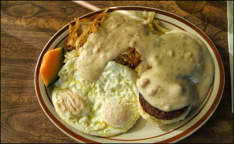 Breakfast plates on a table in a homey eatery.